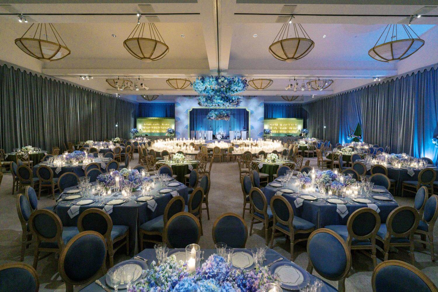 Ballroom wedding reception setup with elegant place settings at Arts District Mansion