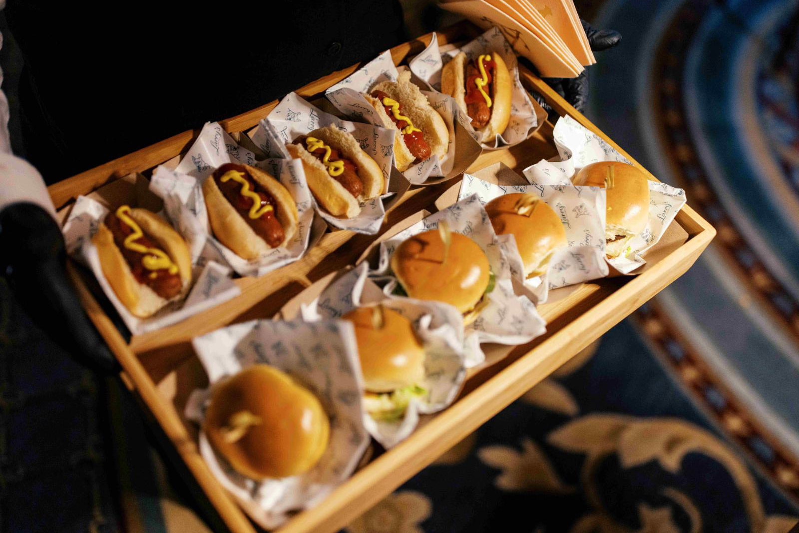 Interactive catering station with mini hot dogs and sliders